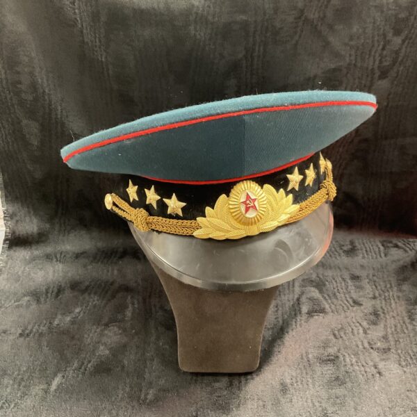 Vintage Soviet military visor cap with gold stars.