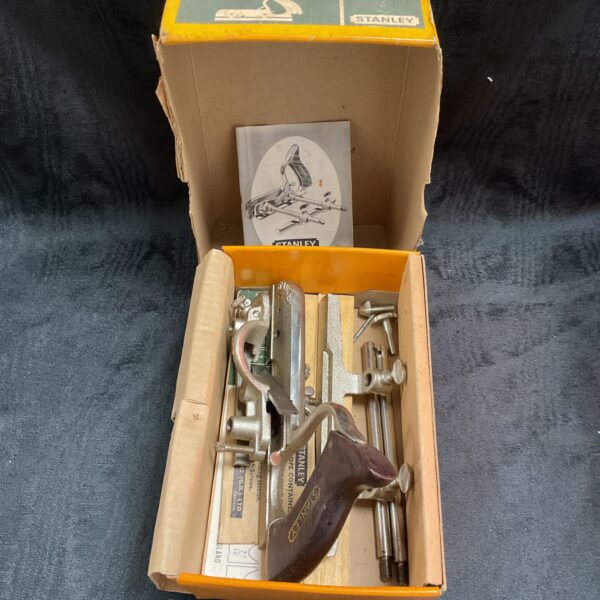 Vintage Stanley 50s combi plane in its original box, a collectable woodworking tool.