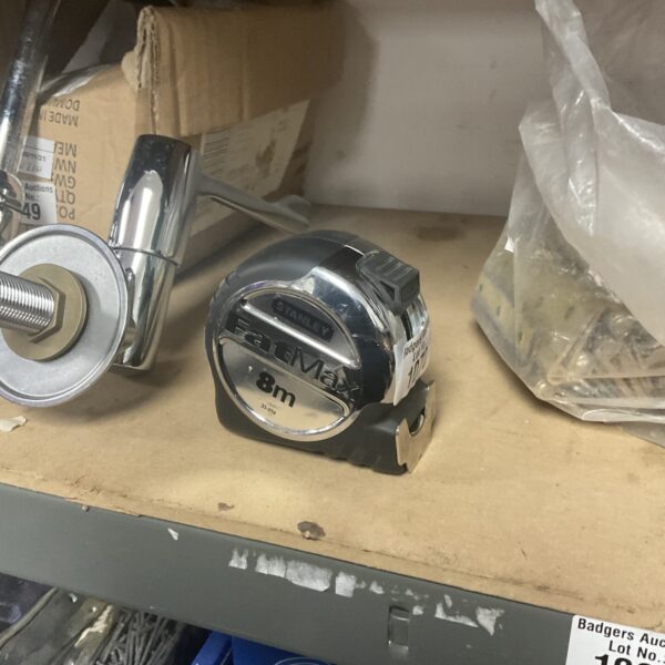 Close-up of a Stanley Fatmax 8m metric tape measure.