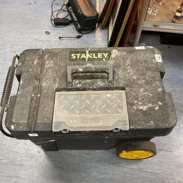Front view of a vintage Stanley rolling tool box.