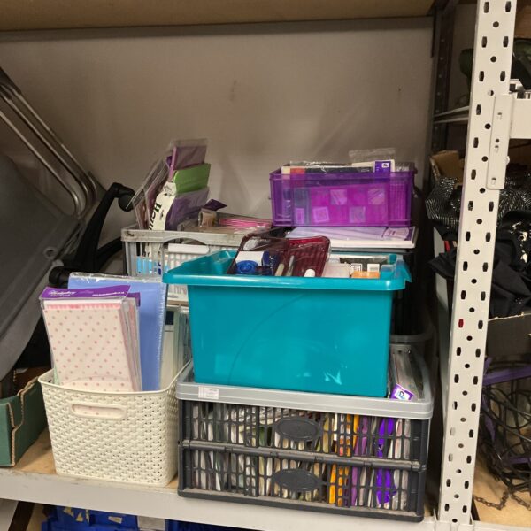 Mixed stationery lot with pens, paper pads and desk organisers.