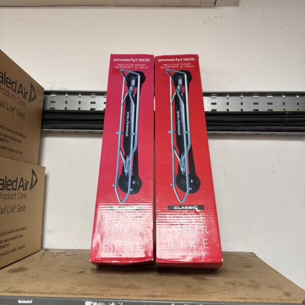 Two Steadyrack Classic bicycle racks for indoor bike storage.