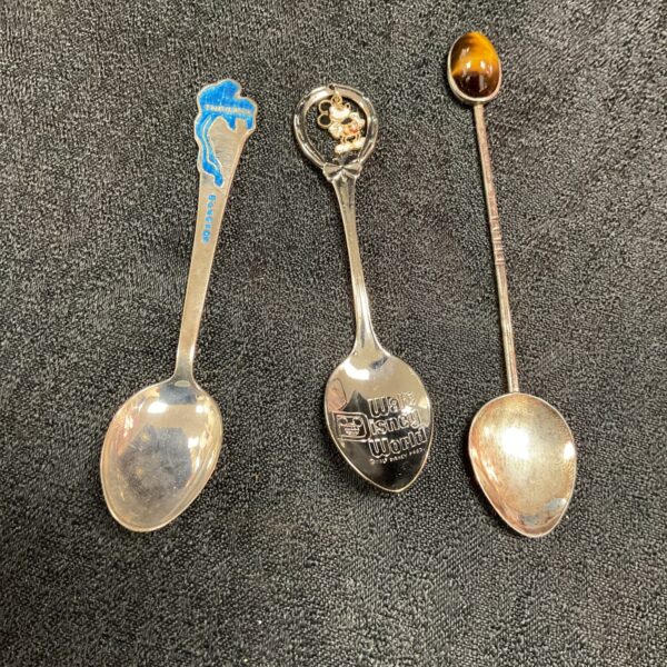 Close-up of a sterling silver Disney spoon with Mickey Mouse.