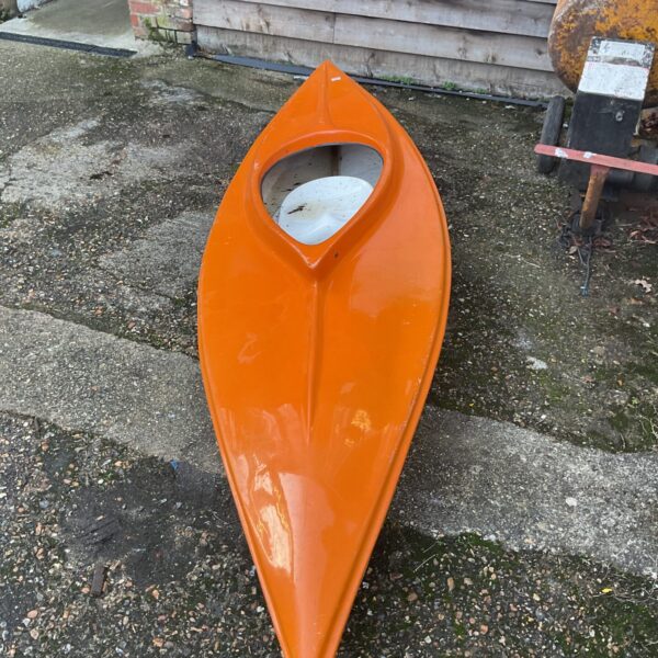 Side view of a red Struer Malik kayak for sale.