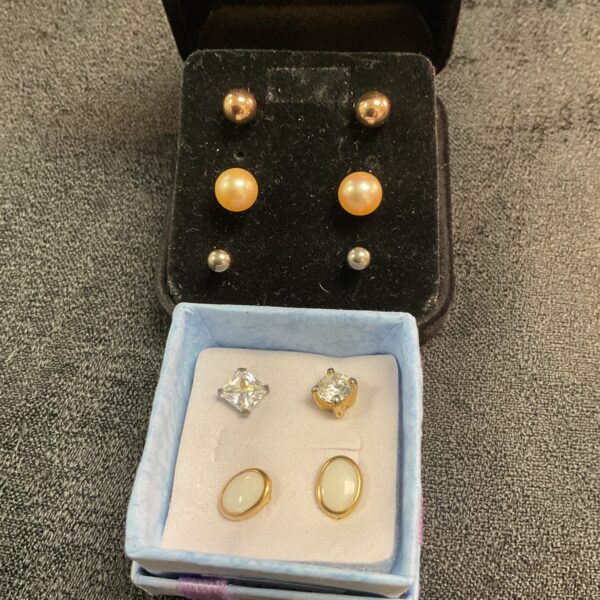 Five pairs of stud earrings including gold ball studs.