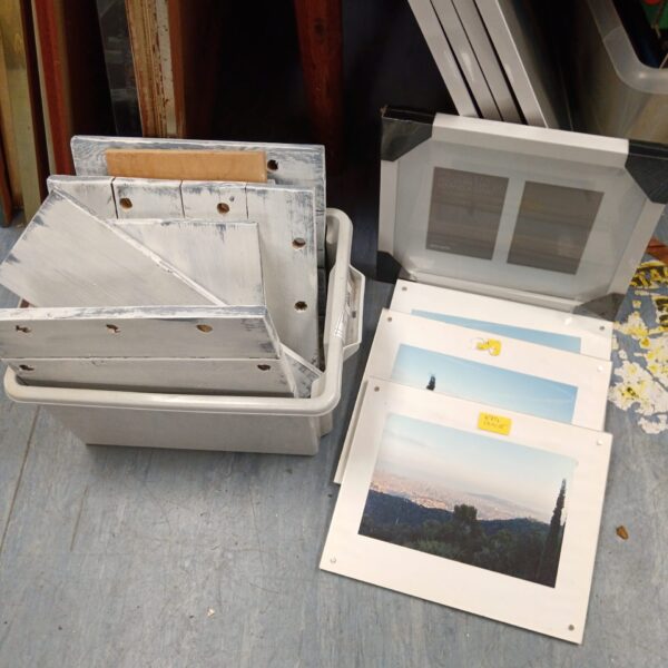 Vintage studio art frames and baroque panels in a collection.