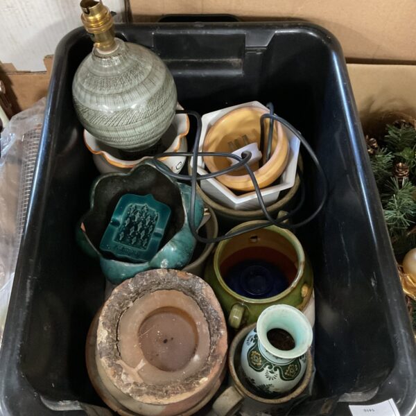 Diverse studio pottery collection with vases, planters and a lamp.