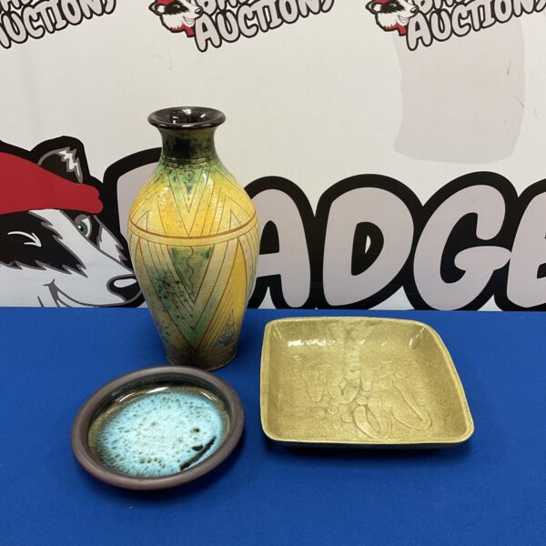 Vintage studio pottery collection featuring a signed vase and dishes.