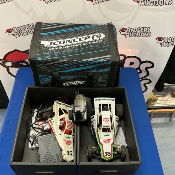 Front view of Tamiya Grasshopper RC car in JConcepts carry case.
