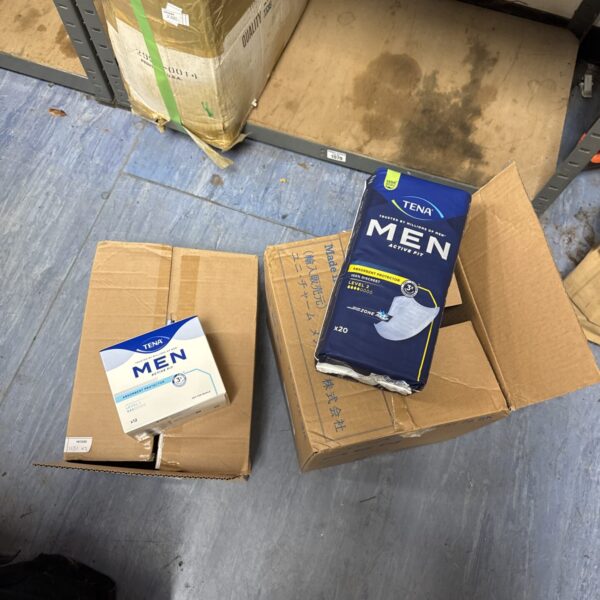 Two boxes of Tena Men Active Pads for incontinence protection.