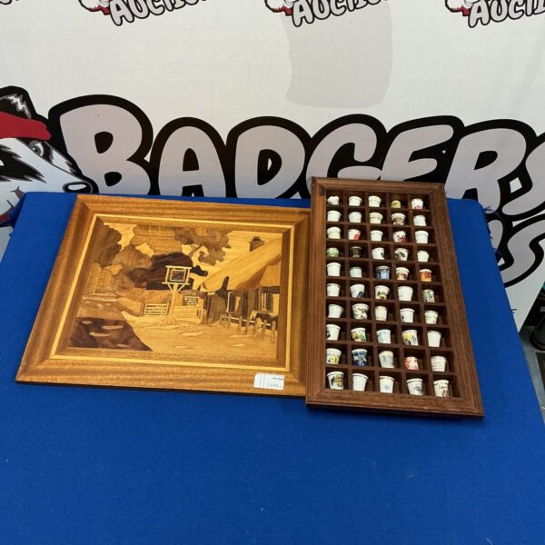 Vintage thimble display frame with a collection of colourful thimbles.