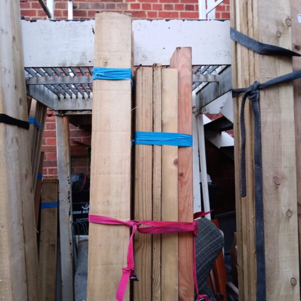 Three bundles of softwood timber for construction and DIY projects.