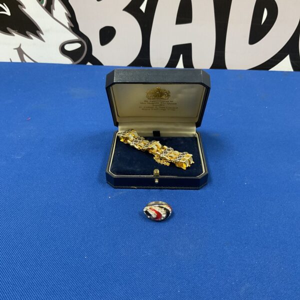 Vintage 1960s Toledo Damascene bracelet and ring set on display.