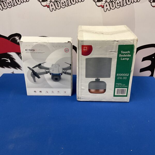 New touch bedside lamp and E99 drone in original packaging.