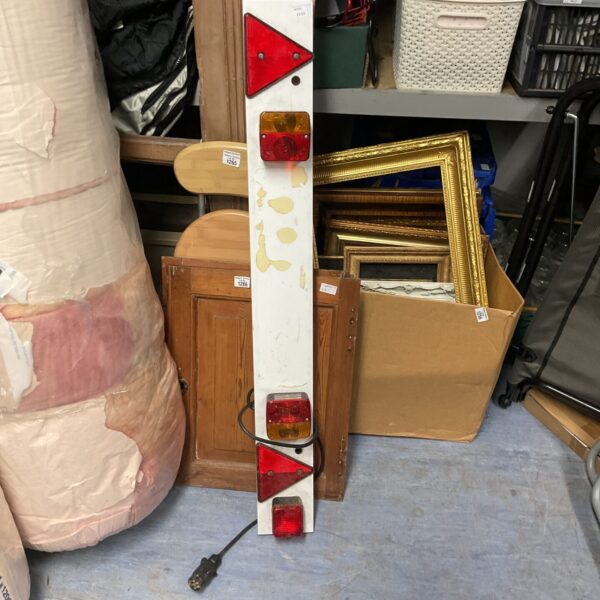 Used trailer light board with red lights and wiring.