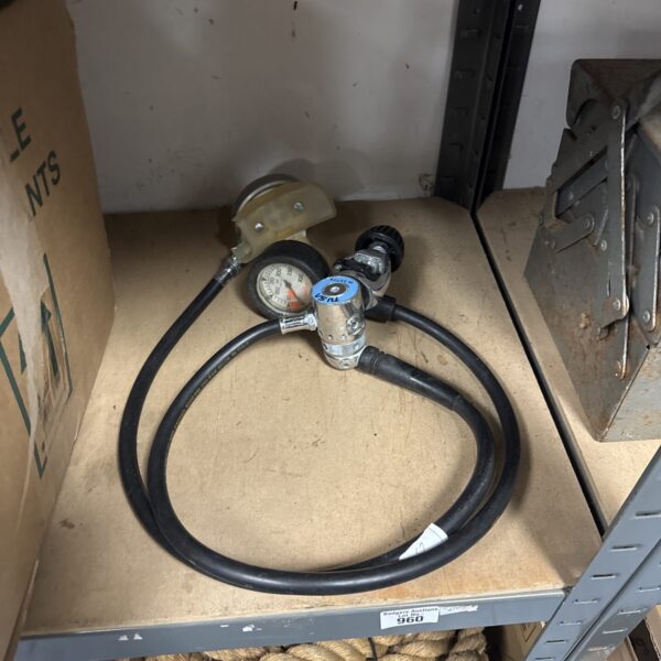 Vintage Tusa scuba regulator with mouthpiece for underwater diving.