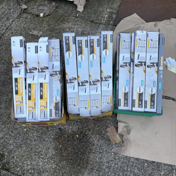 Lot of new TV wall mounts in retail packaging.