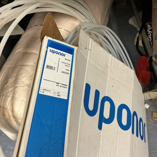 Roll of Uponor PEX tubing for plumbing and heating systems.