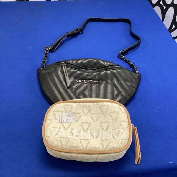 Close-up of a quilted Valentino style handbag with a chain strap.