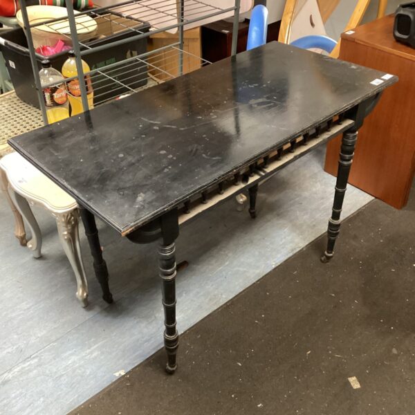 Dark ebonised Victorian card table with folding top.