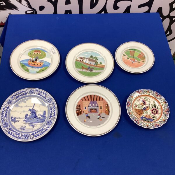 Vintage Villeroy & Boch Delft plates with Dutch scenes.