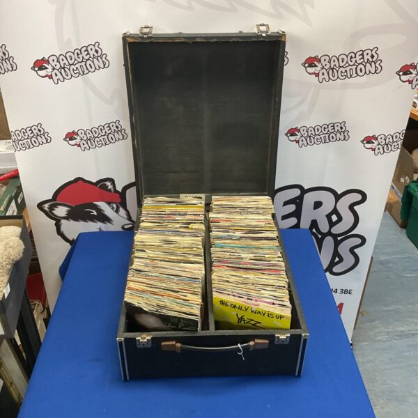 Vintage lot of 7-inch vinyl records in a wooden case.