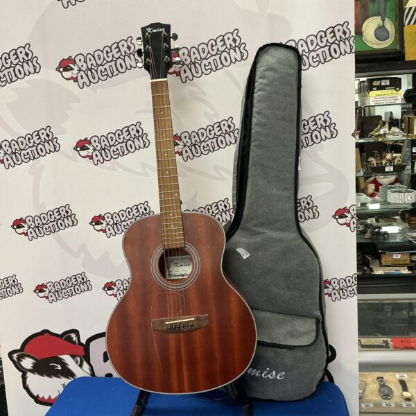 Vintage acoustic guitar with a hard case, ideal for collectors.