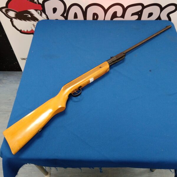 Vintage break barrel air rifle with wooden stock.