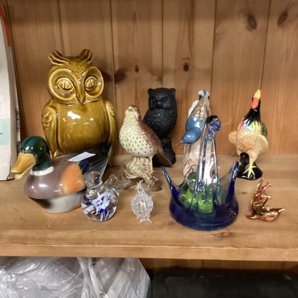 Vintage collection of ceramic and glass animal ornaments.