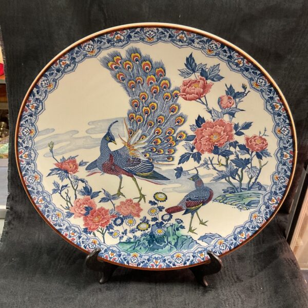 Vintage Asahi peacock plate with detailed floral and bird designs.
