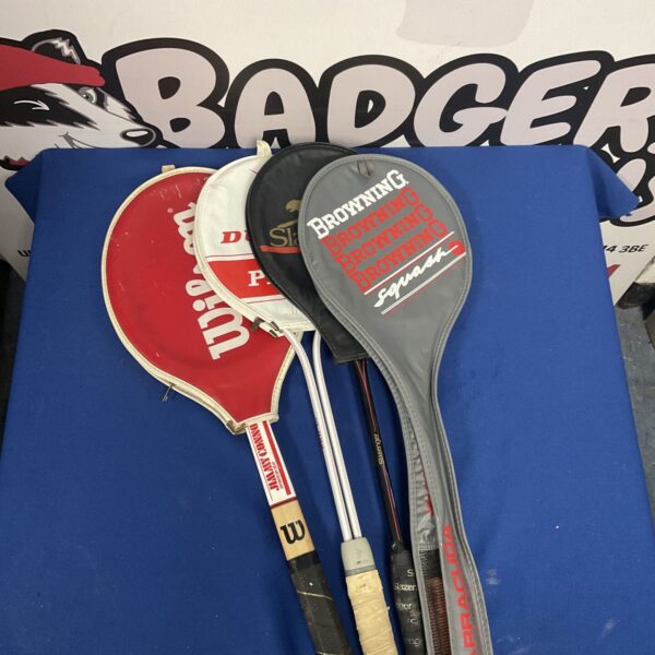 Vintage badminton rackets set, sporting equipment collection.