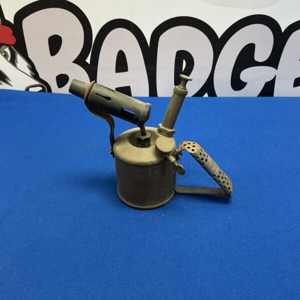 Vintage brass blow lamp with textured base and burner.