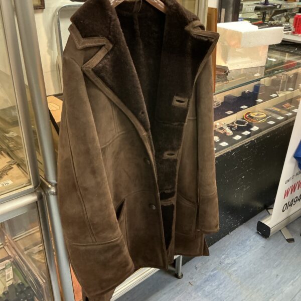 Vintage brown sheepskin coat with shearling lining.
