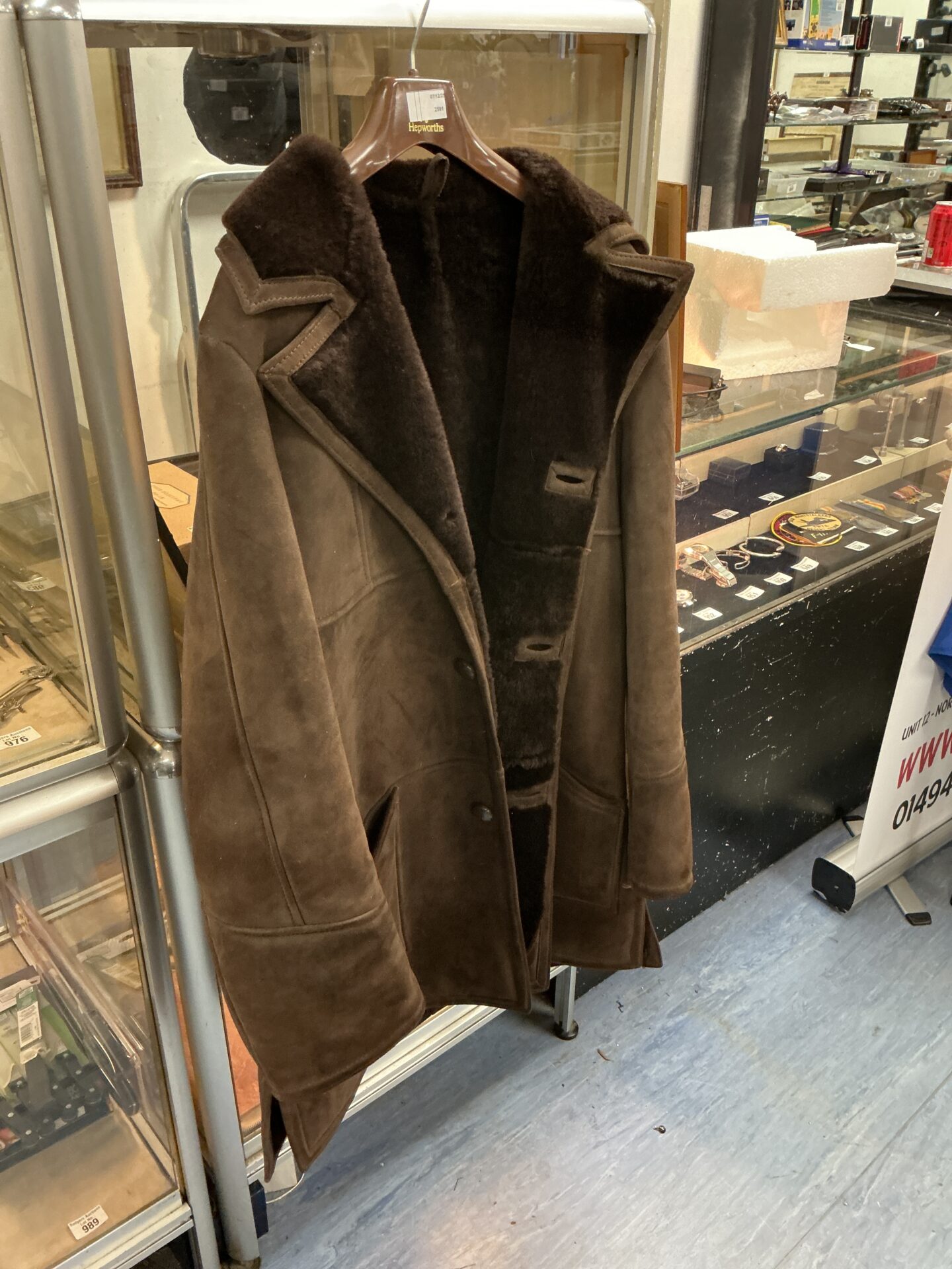Vintage brown sheepskin coat with shearling lining.