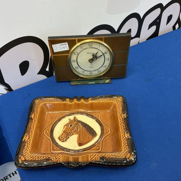 Vintage Canterbury mantle clock and horse wall plaque for collectors.