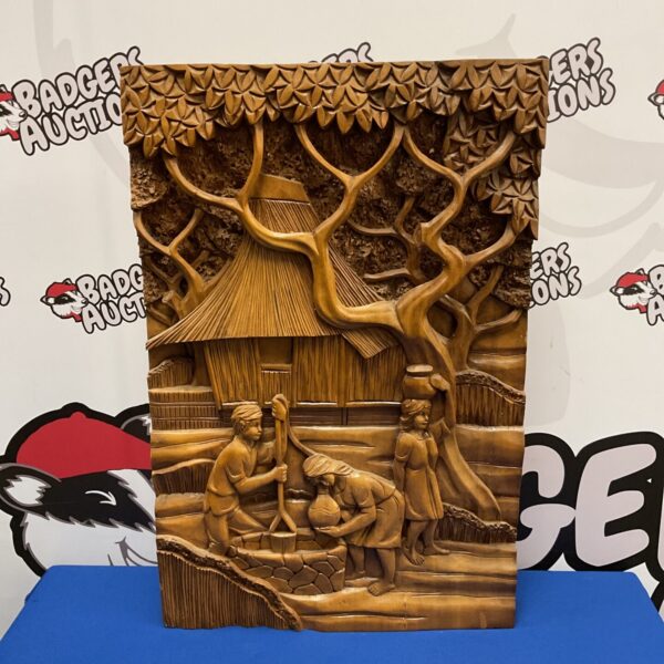 Vintage carved wooden panel depicting children collecting water, folk art.