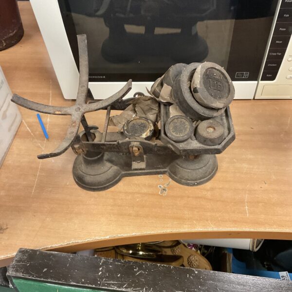 Vintage cast iron kitchen scales with balance pans.