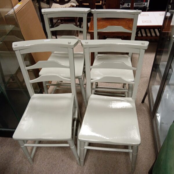 Set of four grey painted vintage chapel chairs.