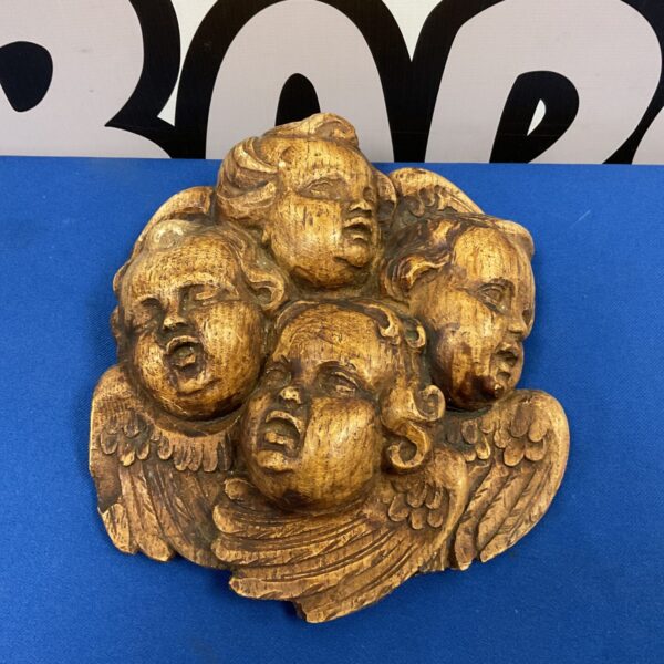 Vintage plaster wall plaque with four cherubs, antique wall decor.