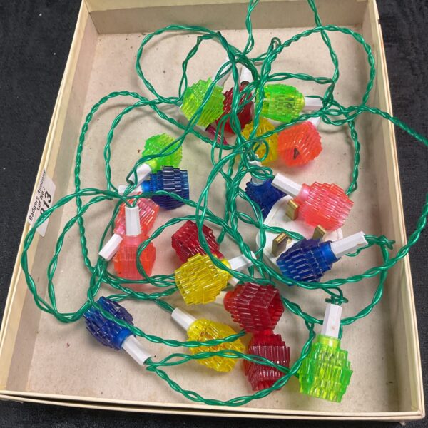 Colourful string of vintage Christmas lantern lights for retro holiday decor.