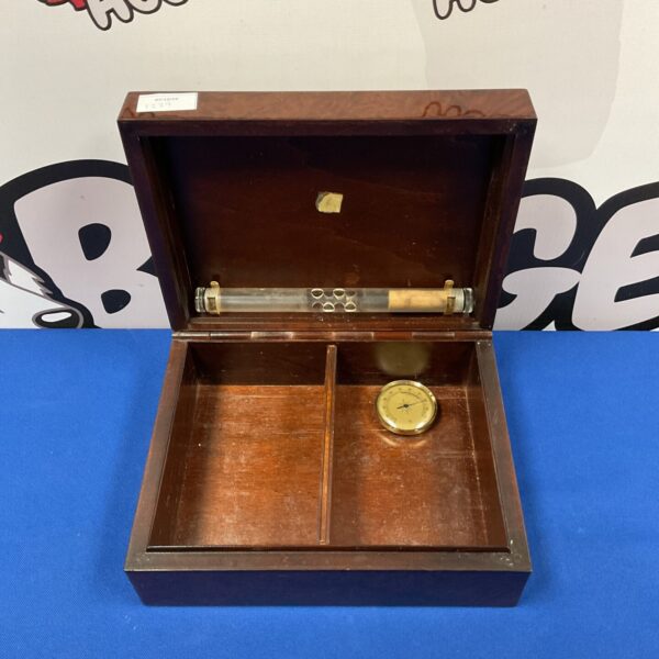 Vintage wooden cigar humidor box with hinged lid.