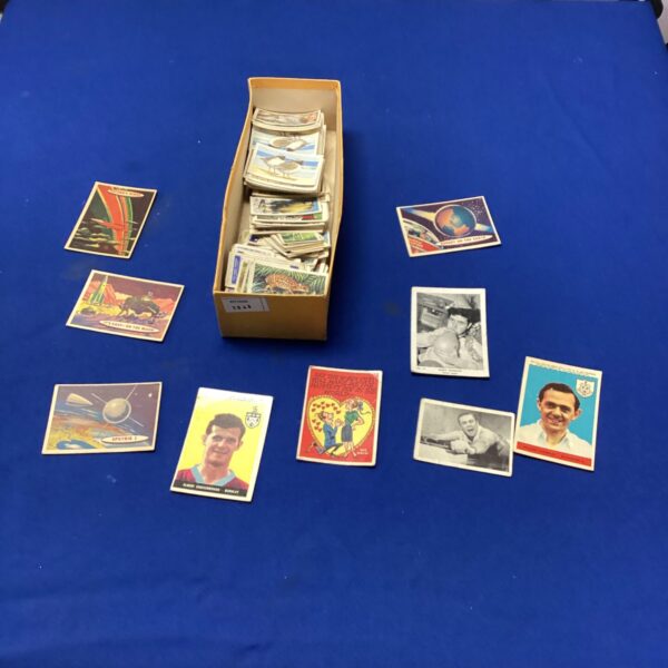 Vintage cigarette card lot with various collectible cards.