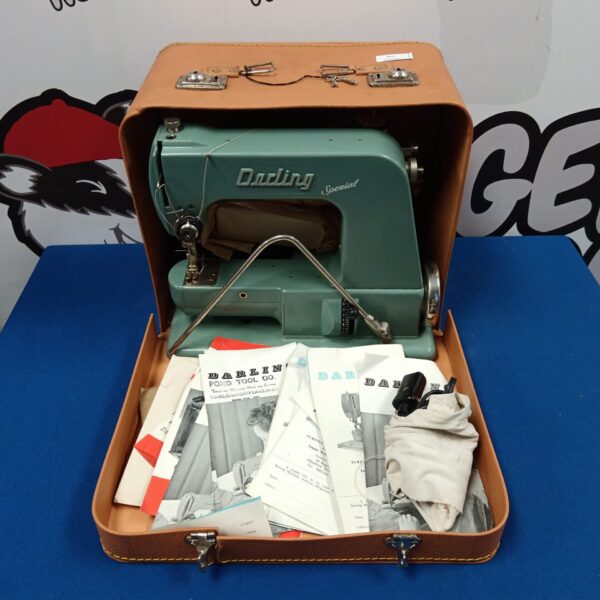 Vintage Darling electric sewing machine in teal case.