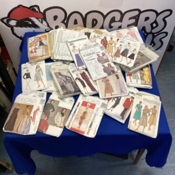 Bundle of vintage dressmaking patterns from the 1970s for sewing projects.