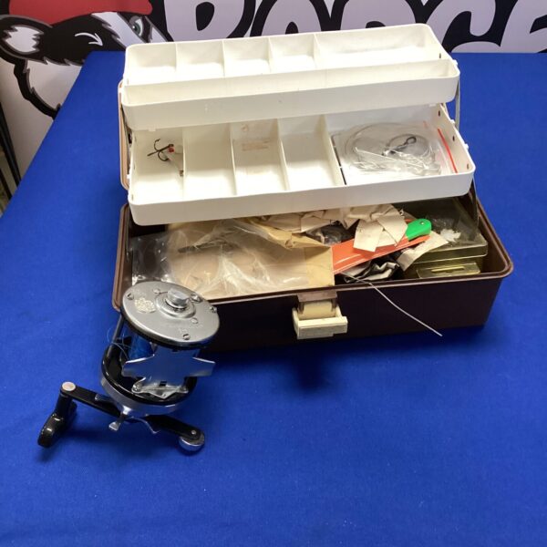 Vintage fishing tackle box with Abu Ambassadeur reel and contents.