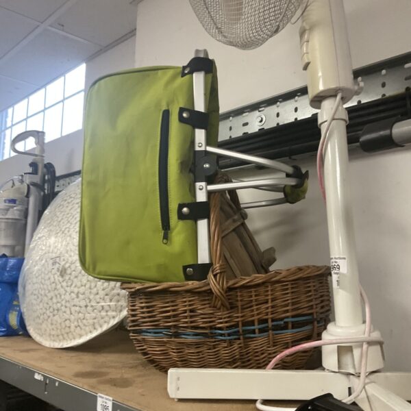 Vintage garden thug with wicker basket and canvas bag.