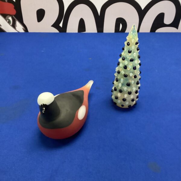 Vibrant vintage glass bird sculpture with amber and black hues.