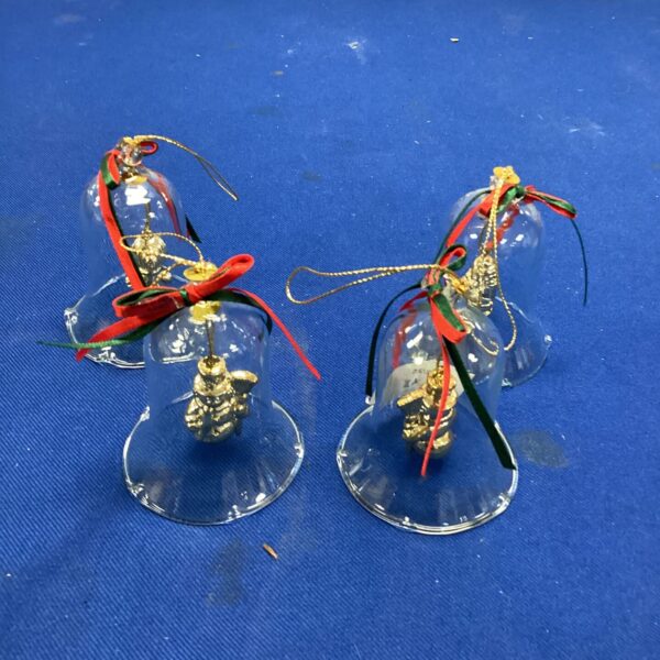 Vintage glass Christmas tree hangers with red ribbon.