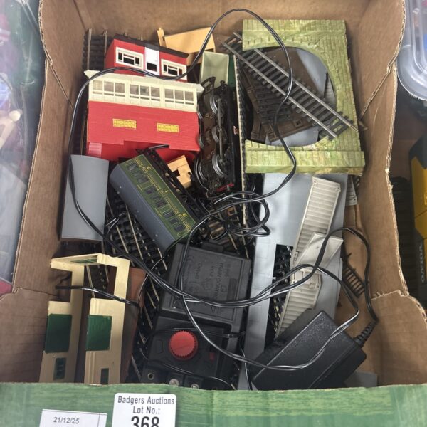 Vintage Hornby railway accessories and track pieces in a box.