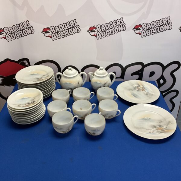 Full view of vintage Japanese porcelain teaset with landscape design.